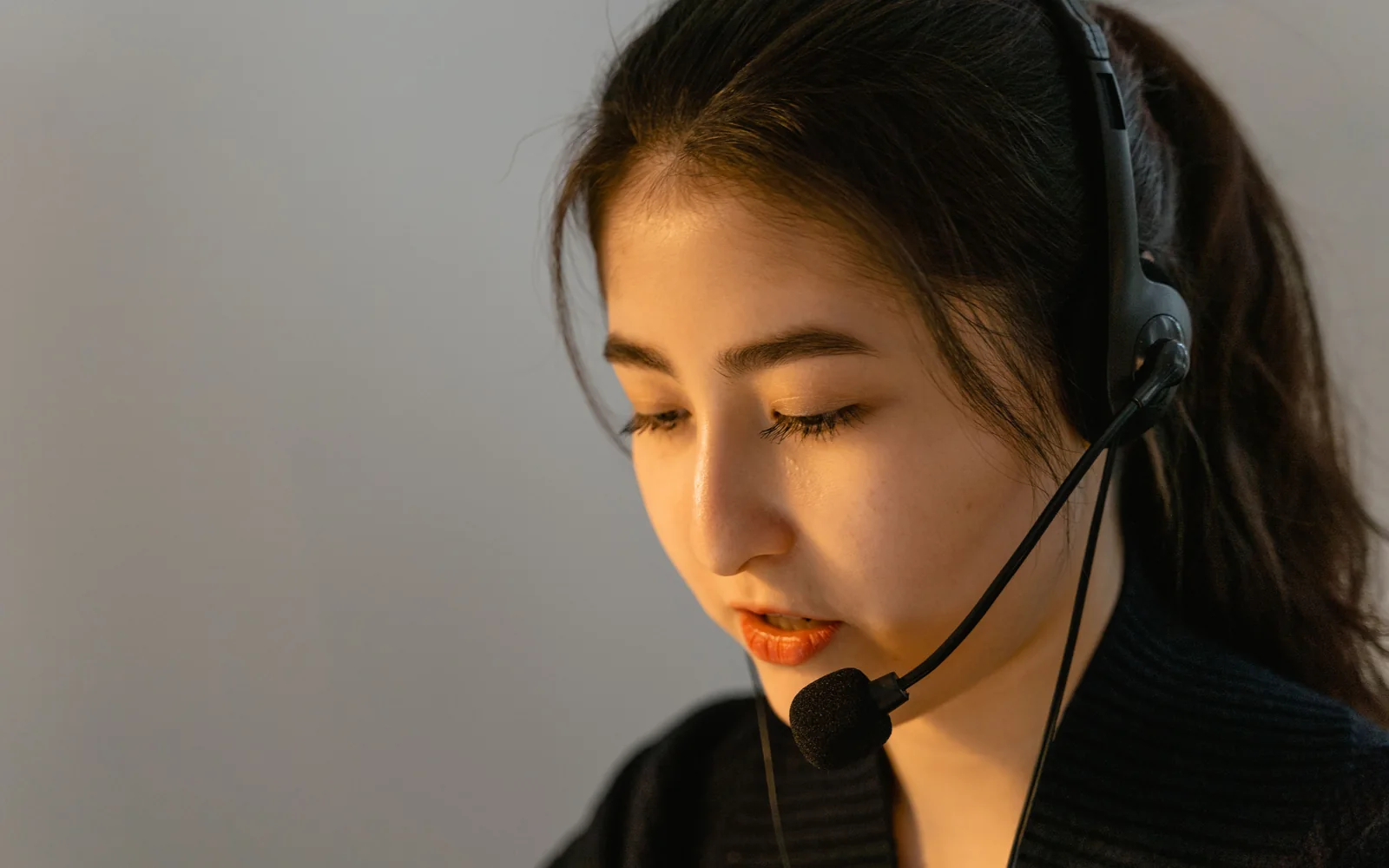 A licensed advisor on a headset helping a client
